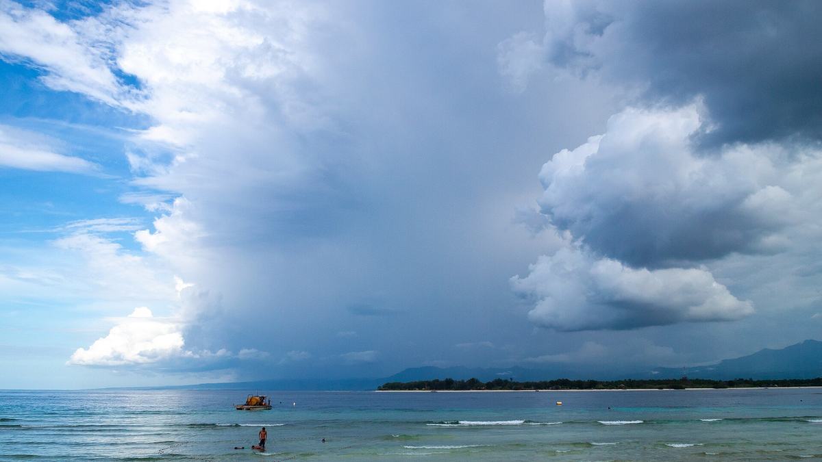 Storm clouds forming over a lake